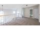 Bright loft area with neutral carpeting and easy access to bathrooms at 15 Misners Trl, Ormond Beach, FL 32174