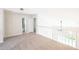 Bright loft area with neutral carpeting and easy access to bathrooms at 15 Misners Trl, Ormond Beach, FL 32174