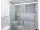 New bathroom features a modern shower with updated tile, glass enclosure, and a handheld shower head at 15 Misners Trl, Ormond Beach, FL 32174