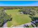 Expansive park features a covered picnic shelter and fire pit on a large grassy area at 1520 Stone Trl, Enterprise, FL 32725
