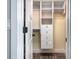 Organized walk-in closet with built-in shelving and drawer units at 1520 Stone Trl, Enterprise, FL 32725