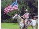 Picture of a patriotic gentleman on horseback at 1520 Stone Trl, Enterprise, FL 32725