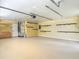Spacious two-car garage with ample storage and well-organized hanging rack system at 1520 Stone Trl, Enterprise, FL 32725