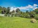 Expansive backyard featuring a gazebo by the water, perfect for outdoor relaxation at 1520 Stone Trl, Enterprise, FL 32725
