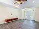 Spacious living room featuring a built-in entertainment center and a large arched window with natural light at 1520 Stone Trl, Enterprise, FL 32725