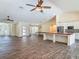 Spacious living area with a kitchen island, tile floors, and lots of natural light at 1520 Stone Trl, Enterprise, FL 32725