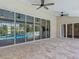 Large covered patio with tile flooring overlooking the pool at 1520 Stone Trl, Enterprise, FL 32725