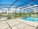 Beautiful outdoor pool area with screened enclosure and a gazebo in a landscaped backyard at 1520 Stone Trl, Enterprise, FL 32725