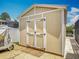 Exterior view of a well-maintained shed with double doors at 1520 Stone Trl, Enterprise, FL 32725