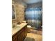 Bathroom featuring a shower with a patterned curtain and classic vanity at 15555 Sw 46Th Cir, Ocala, FL 34473