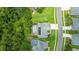 Aerial view of the property featuring a pool, manicured lawn, landscaping, and proximity to neighborhood amenities at 1910 Creekwater Blvd, Port Orange, FL 32128