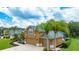 Charming home with well-manicured landscaping, mature trees, and a two-car garage at 1910 Creekwater Blvd, Port Orange, FL 32128