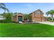 Charming single-Gathering home with a well-manicured lawn and a beautiful blue front door at 1910 Creekwater Blvd, Port Orange, FL 32128
