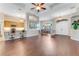 Spacious living room with wood floors, an open floor plan, and lots of natural light at 1910 Creekwater Blvd, Port Orange, FL 32128