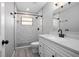 This bathroom offers a shower with white tile surround, a modern vanity, and a toilet at 2032 Yorkshire Dr, Deland, FL 32724