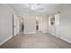 Bedroom with neutral carpeting, white trim, and ceiling fan at 2032 Yorkshire Dr, Deland, FL 32724