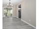 Dining area with light gray floors and sliding door to the backyard at 2032 Yorkshire Dr, Deland, FL 32724
