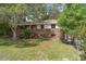 Charming brick two-story home with a well-maintained front yard and mature trees at 2032 Yorkshire Dr, Deland, FL 32724