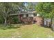 Charming brick two-story home with a well-maintained front yard and mature trees at 2032 Yorkshire Dr, Deland, FL 32724