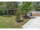 Charming brick two-story home with a well-maintained front yard and mature trees at 2032 Yorkshire Dr, Deland, FL 32724