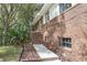 Charming brick two-story home with a well-maintained front yard and mature trees at 2032 Yorkshire Dr, Deland, FL 32724