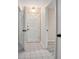The hallway features neutral walls and flooring leading to various rooms in the home at 2032 Yorkshire Dr, Deland, FL 32724