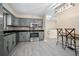Modern kitchen with stainless steel appliances, granite countertops and bar seating at 2032 Yorkshire Dr, Deland, FL 32724