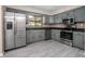 Kitchen featuring stainless steel appliances and gray cabinetry and countertops at 2032 Yorkshire Dr, Deland, FL 32724