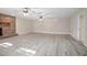 The spacious living room has a brick fireplace and ceiling fans for added comfort at 2032 Yorkshire Dr, Deland, FL 32724