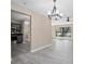 Bright living room, showcasing gray floors and open floor plan to kitchen at 2032 Yorkshire Dr, Deland, FL 32724