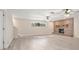 The spacious living room has a brick fireplace and ceiling fans for added comfort at 2032 Yorkshire Dr, Deland, FL 32724