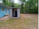Spacious backyard with an outdoor storage shed, offering ample storage and organization at 20422 Canvas Back Rd, Altoona, FL 32702