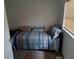 Bedroom with striped bedding and a sunlit window at 20422 Canvas Back Rd, Altoona, FL 32702