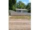 Quaint blue home surrounded by a white fence, offering privacy and curb appeal at 20422 Canvas Back Rd, Altoona, FL 32702