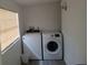 Convenient laundry room featuring a modern washer and dryer set, enhancing home functionality at 20422 Canvas Back Rd, Altoona, FL 32702