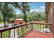 Backyard view from a brick deck with trees and a patio at 2221 Oak Hill Dr, Deland, FL 32720