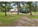 Large barn with covered parking and living space offers ample room for vehicles and storage at 2221 Oak Hill Dr, Deland, FL 32720