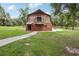 Barn featuring a brick facade and wood siding, accompanied by a charming balcony at 2221 Oak Hill Dr, Deland, FL 32720