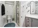 Bathroom with glass enclosed shower, toilet and vanity with a mirror at 2221 Oak Hill Dr, Deland, FL 32720