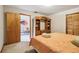 A bedroom with wooden closet and a view into living room at 2221 Oak Hill Dr, Deland, FL 32720