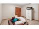 Neutral bedroom with basic furniture, carpeted floor, and a closet, providing a versatile space at 2221 Oak Hill Dr, Deland, FL 32720