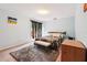 Bright bedroom with private patio access and a cozy rug at 2221 Oak Hill Dr, Deland, FL 32720