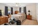 Inviting bedroom with a ceiling fan, neutral walls, and two large windows at 2221 Oak Hill Dr, Deland, FL 32720