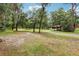 Expansive lot with lush landscape and treelined views offering privacy at 2221 Oak Hill Dr, Deland, FL 32720