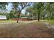 Extensive lawn and tree-lined views surround this home, providing lots of privacy at 2221 Oak Hill Dr, Deland, FL 32720