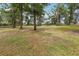 Large lot with grass and treelined views at 2221 Oak Hill Dr, Deland, FL 32720