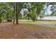 Large lot with lush landscape and outbuildings at 2221 Oak Hill Dr, Deland, FL 32720