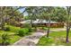 Charming single-story brick home with a metal roof, manicured lawn, and a welcoming entrance at 2221 Oak Hill Dr, Deland, FL 32720