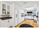Bright white kitchen features updated appliances and sleek countertops at 2221 Oak Hill Dr, Deland, FL 32720