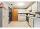 Functional kitchen with white cabinets, and appliances, including a dishwasher and oven at 2221 Oak Hill Dr, Deland, FL 32720